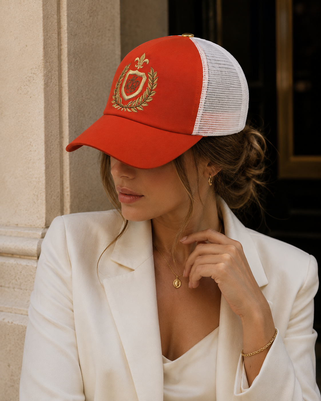 Premium orange embroidered women’s trucker cap made in France