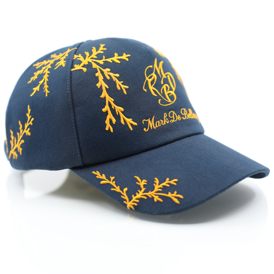 casquette de luxe bleu marine branchage orange profil avant gauche rivet argenté collection Prestige Mark De Belleroy